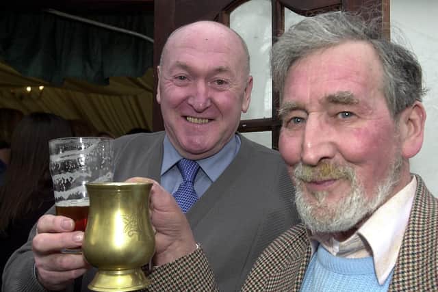 Former Saddle landlord John Moore, here pictured left, with Norman Wakefield at the pub’s 2002 beer festival. John has died at the age of 86