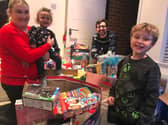 Kelly, Theo and Lewis Smith with Fleetwood Together volunteer Chris Rumley.