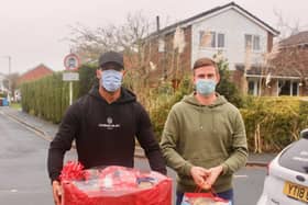 The fitness of Chris Neal (right) and Nathan Pond, here delivering Christmas presents in the community this week, is a boost for AFC Fylde going into the festive fixtures