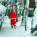 Father Christmas makes his way through the snow in Hutton in 2010