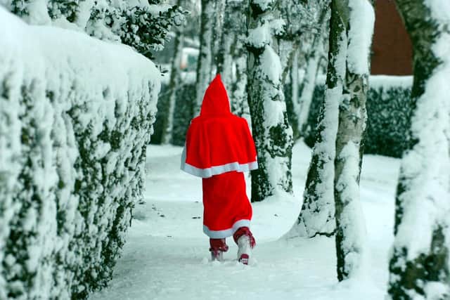 Father Christmas makes his way through the snow in Hutton in 2010
