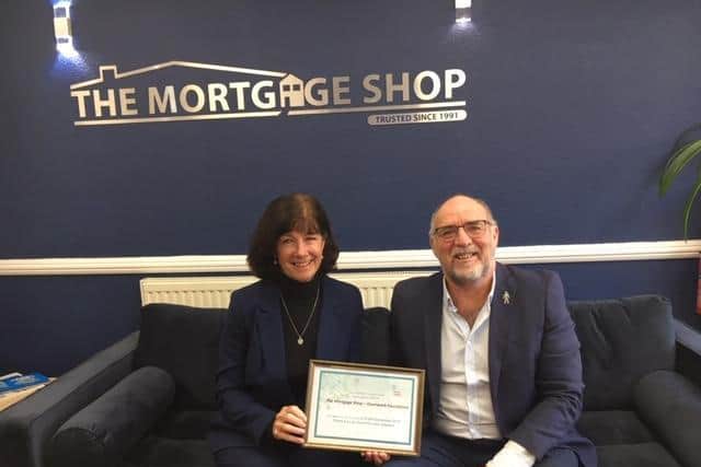 John and Marina Norris, of the Mortgage Shop on Topping Street, helped to secure a £10,000 grant for Trinity Hospice.