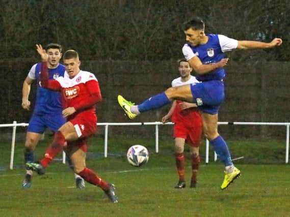 Squires Gate's James Boyd has a shot blocked by the Longridge defence
Picture: IAN MOORE