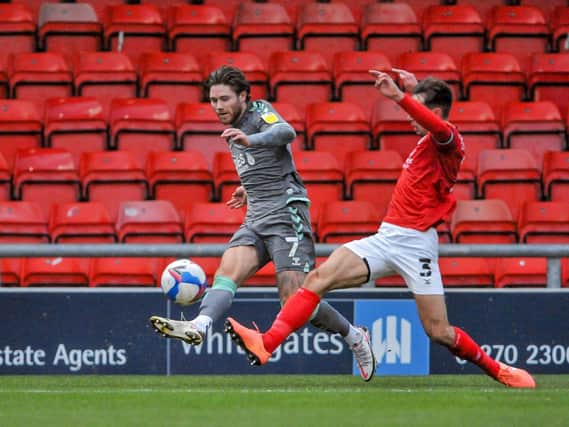 Fleetwood's Wes Burns takes on the defence in his more attacking role at Crewe