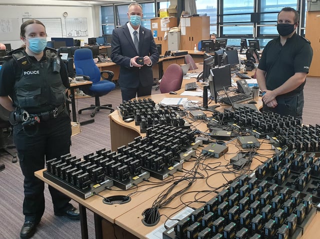 Clive Grunshaw (centre), Lancashire Police and Crime Commissioner, tests out the nwq cameras with Ch Insp Dave Hannan and an officer at Greenbank police station, Blackburn