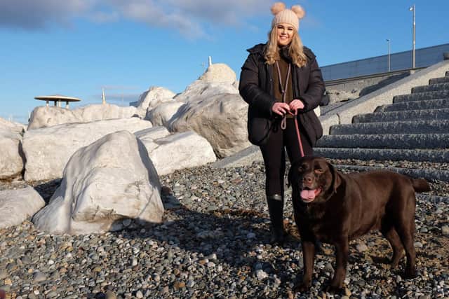 Vicki Smith-Payne next to the rocks Labrador Bruno got stuck under on Cleveleys beach.