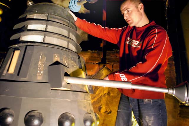 The Doctor Who exhibition nearing completion in the Golden Mile Centre,  2004. Exhibition Manager Mark Jacabs comes face to face with a Dalek.