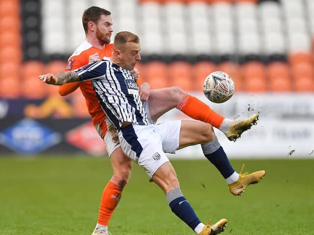 Ollie Turton was penalised for a handball after Kamil Grosicki, right, blasted the ball at his arm