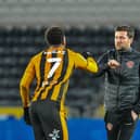 Interim boss Simon Wiles with Hull goalscorer Mallik Wilks after Fleetwood's defeat the the KCOM