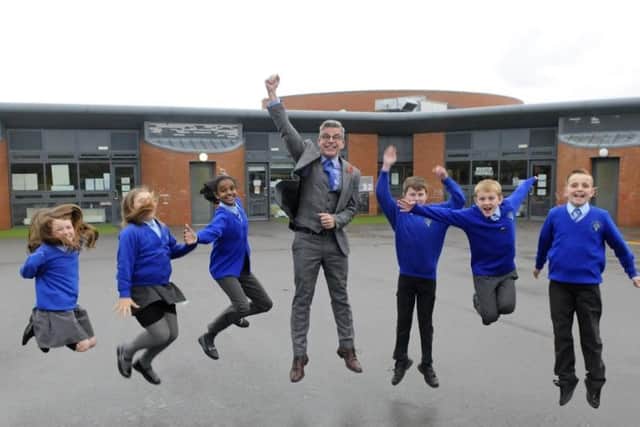 Layton Primary School's headteacher Jonathan Clucas, pictured before the pandemic while celebrating a complimentary Ofsted report with pupils (Picture: The Gazette archives)