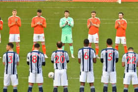 Blackpool and West Bromwich Albion players paid tribute to those who passed away last year before last weekend's match