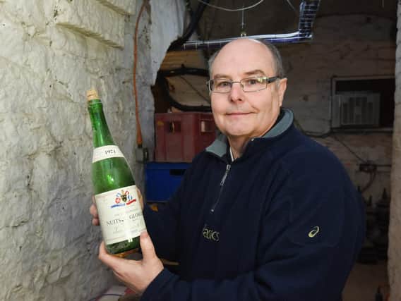 North Euston Hotel general manager Stephen Dale with one of the old bottles found in the old cellar room