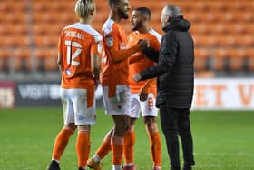 Neil Critchley and his Blackpool players celebrate victory over Hull City last month
