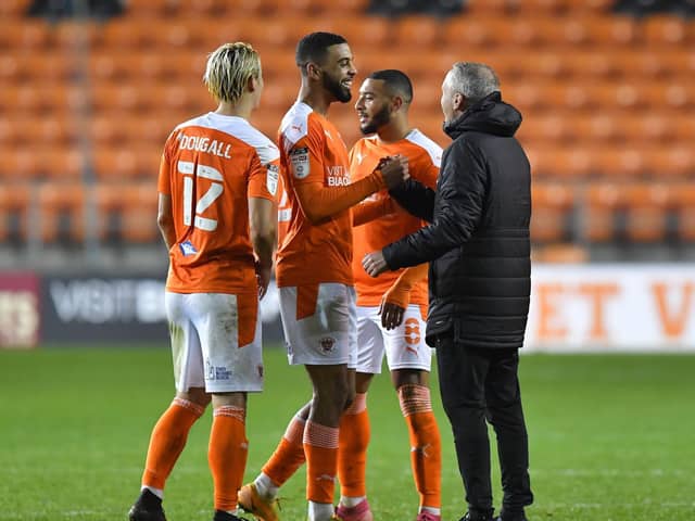 Neil Critchley and his Blackpool players celebrate victory over Hull City last month