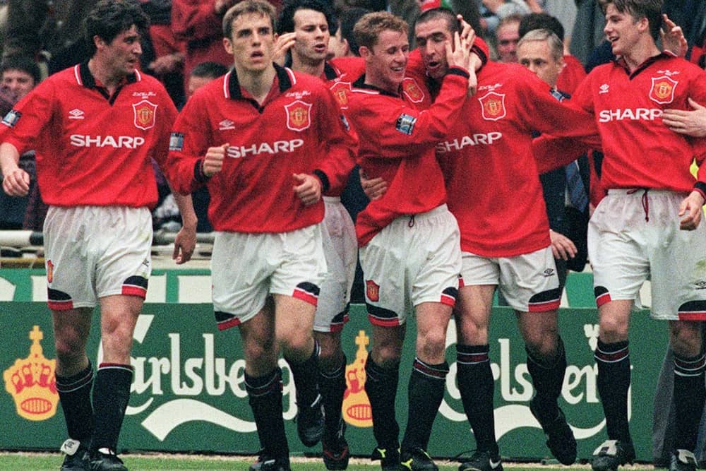 United celebrate Eric Cantona's late FA Cup final winner in 1996