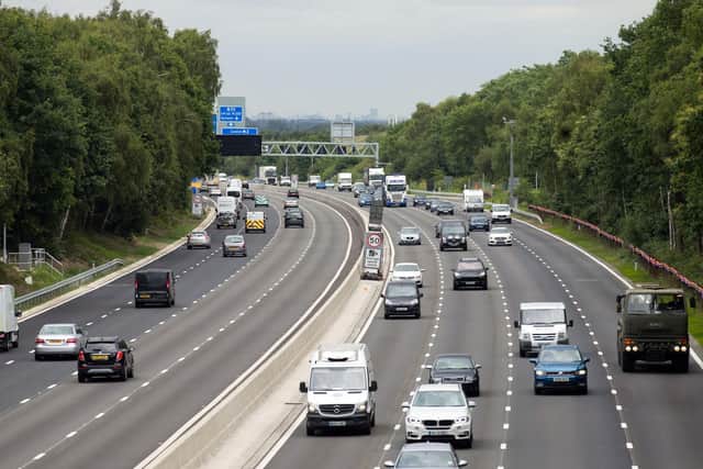 Vehicles on the 13.4-mile long M3 'smart' motorway near Longcross, Surrey