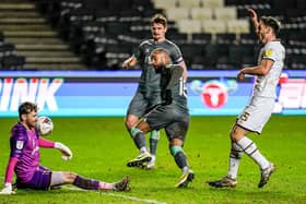 Kyle Vassell is denied a first Fleetwood goal by MK Dons keeper Andrew Fisher