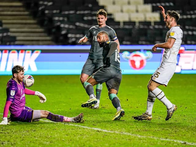 Kyle Vassell is denied a first Fleetwood goal by MK Dons keeper Andrew Fisher