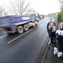 Residents close to Bourne Road in Thornton want traffic calming measures and better footpaths and lighting installed due to speeding cars and trucks. Pictured are Lindsay Gemmell and Robert Goodwin with Millie Gemmell at the spot where they were nearly hit by a car.