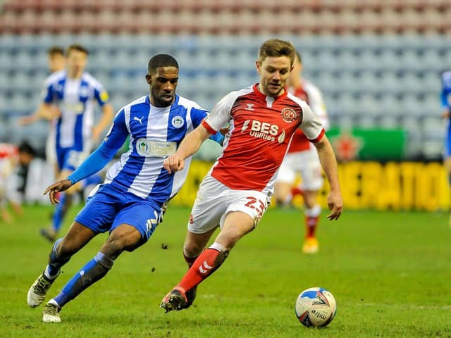 Sam Finley is challenged by Wigan's Tendayi Darikwa in the DW Stadium stalemate