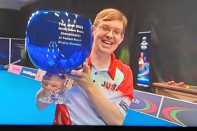 Mark Dawes has followed last week's open pairs title by lifting the open singles trophy at the World Indoor Bowls Championships