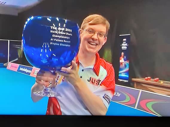Mark Dawes has followed last week's open pairs title by lifting the open singles trophy at the World Indoor Bowls Championships