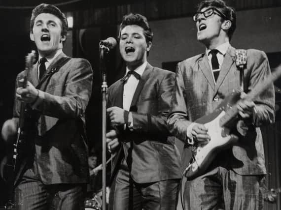 Cliff Richard (centre) with two of The Shadows, Bruce Welch (left) and Hank Marvin (right).