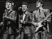 Cliff Richard (centre) with two of The Shadows, Bruce Welch (left) and Hank Marvin (right).