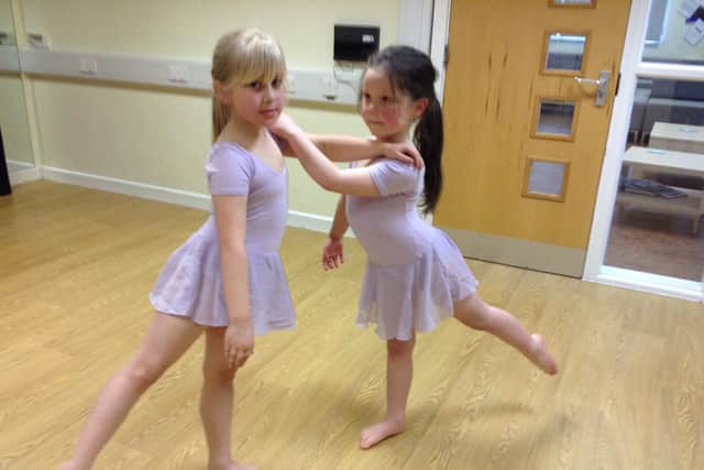 Two youngsters at Boundary Primary during dance lessons