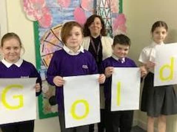 Pupils at Boundary School celebrate the Gold Mark award