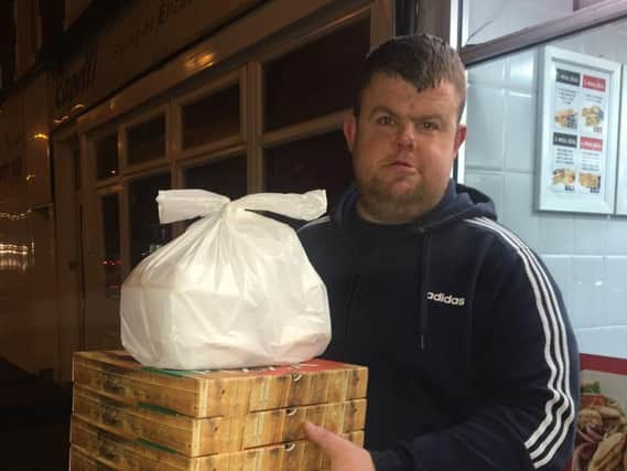 Big Ryan with pizzas and chips