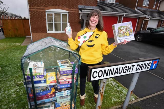 Chelley Thompson has set up a community jigsaw library outside her home on Connaught Drive, Thornton. Photo: Daniel Martino, JPI Media