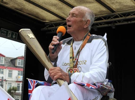 Dave Burns with the Olympic torch in 2012