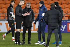 Referee Christopher Sarginson explains Tuesday night's call-off to Blackpool boss Neil Critchley