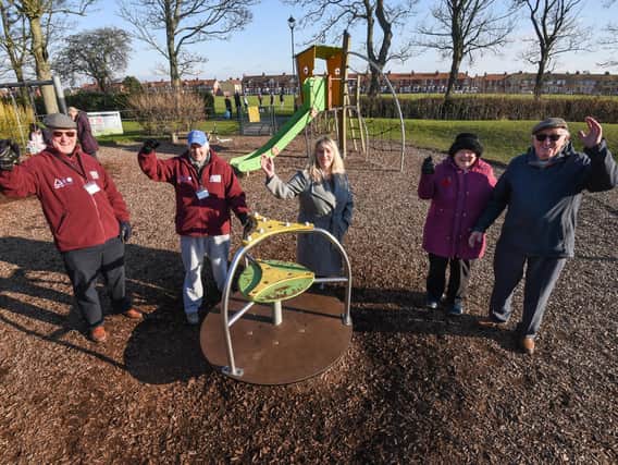 Members of the Friends of the Memorial Park celebrate confirmation of funds for the play area.