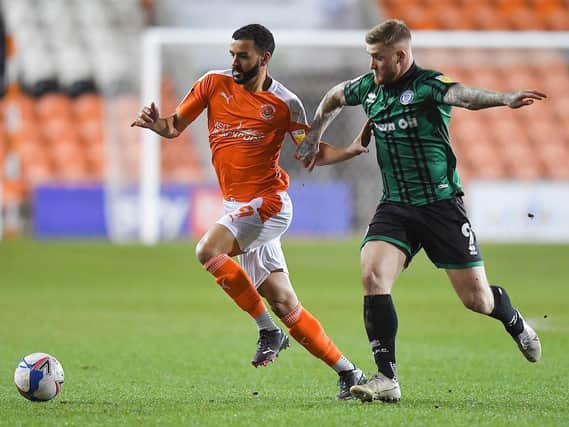 Kevin Stewart battles for possession during Blackpool's 1-0 win
