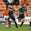 Matchwinner Sullay Kaikai takes on the Rochdale defence during Blackpool's hard-earned victory at Bloomfield Road