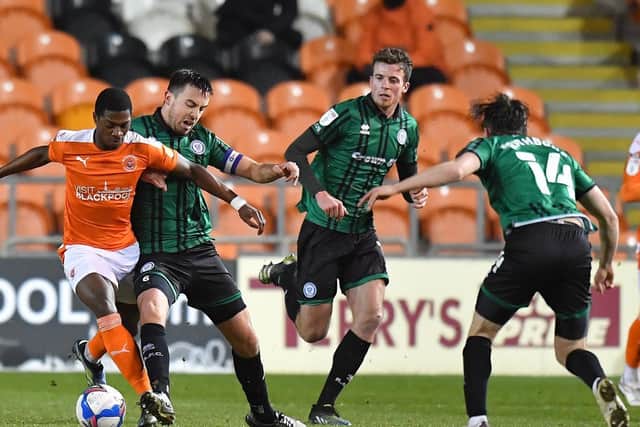 Matchwinner Sullay Kaikai takes on the Rochdale defence during Blackpool's hard-earned victory at Bloomfield Road