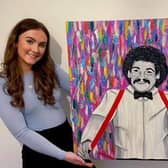 Beth Holyoak with her portrait of Bobby Ball