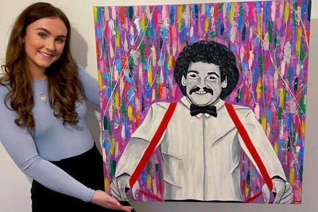 Beth Holyoak with her portrait of Bobby Ball