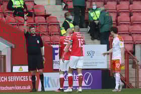 Referee Brett Huxtable brandishes a red card to Darren Pratley