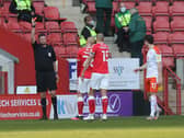 Referee Brett Huxtable brandishes a red card to Darren Pratley