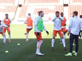 James Husband, centre, injured his calf during Saturday's warm-up