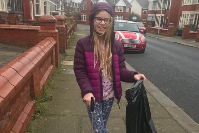 Amelia Brookes doing her bit for the community by  litter picking