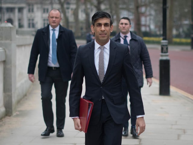 Chancellor of the Exchequer, Rishi Sunak, walks from the Treasury to No 11 Downing Street, London, the day before delivering his budget.