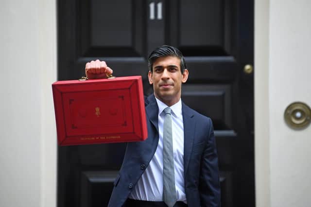 Chancellor Rishi Sunak with the traditional Budget red box outside Number 11 Downing Street