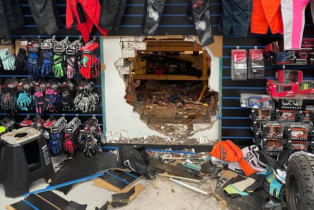 Four bikes - worth thousands - were fed through the hole by the thieves who smashed through three layers of brick to gain entry
