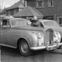 George Formby with his personalised Rolls Royce cars at his home