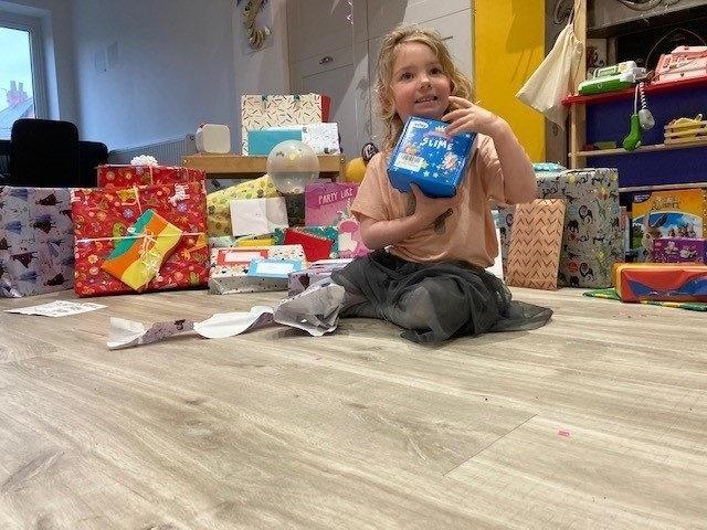 Mary starts opening her presents - the fun had only just begun...