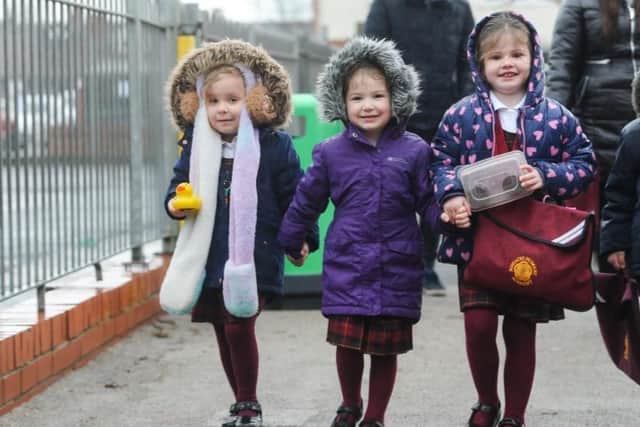 Pupils at Roseacre Primary Academy return to school as coronavirus lockdown restrictions begin to lift.  L-R Friends Gracie-Mae Green, Meredith Evans and Lilly Weddle make their way to class.